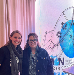 Heather Blicher and Molly Ledermann, Chair, MI OER Network Conference Planning Committee, Washtenaw Community College in front of Michigan OER Network Conference sign